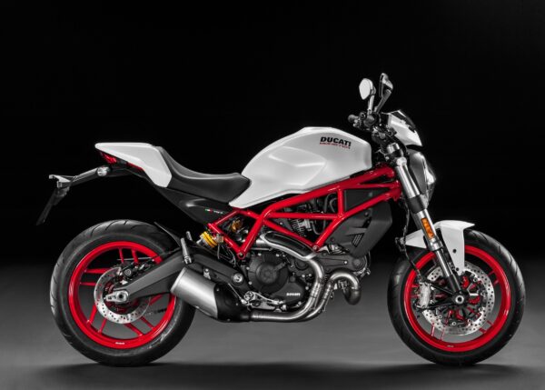 Бял Ducati Monster с червена рамка върху черен фон