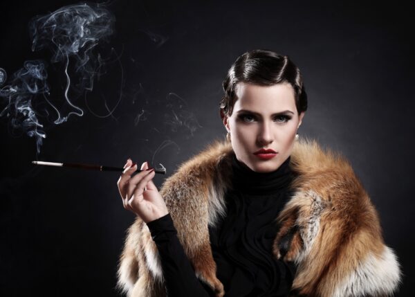 Vintage female portrait with fur coat and cigarette.