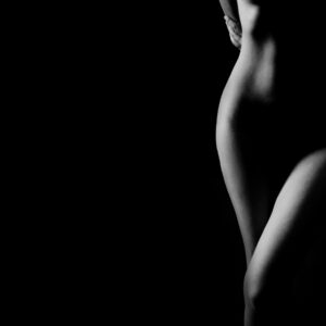 Black and white artistic photo of a minimalist female silhouette.