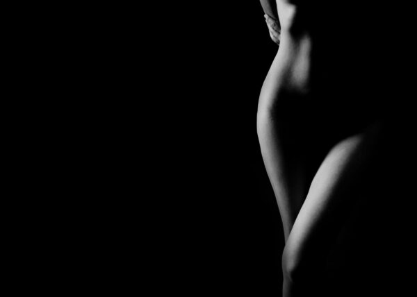 Black and white artistic photo of a minimalist female silhouette.