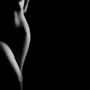 Elegant black and white photo of a female silhouette in minimalist style.