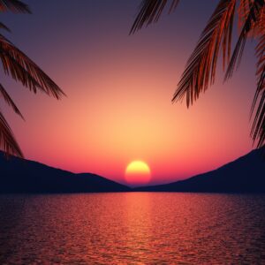 Залез над морето с палмови клони на преден план.